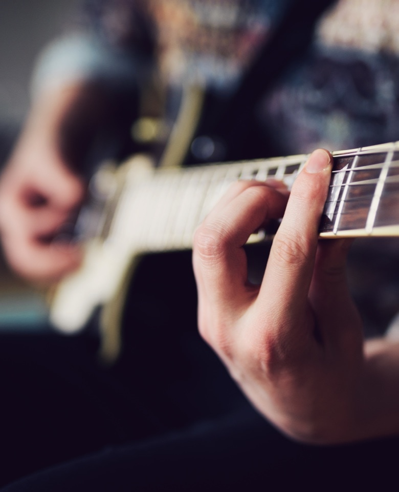 man playing guitar at limelight residences mammoth